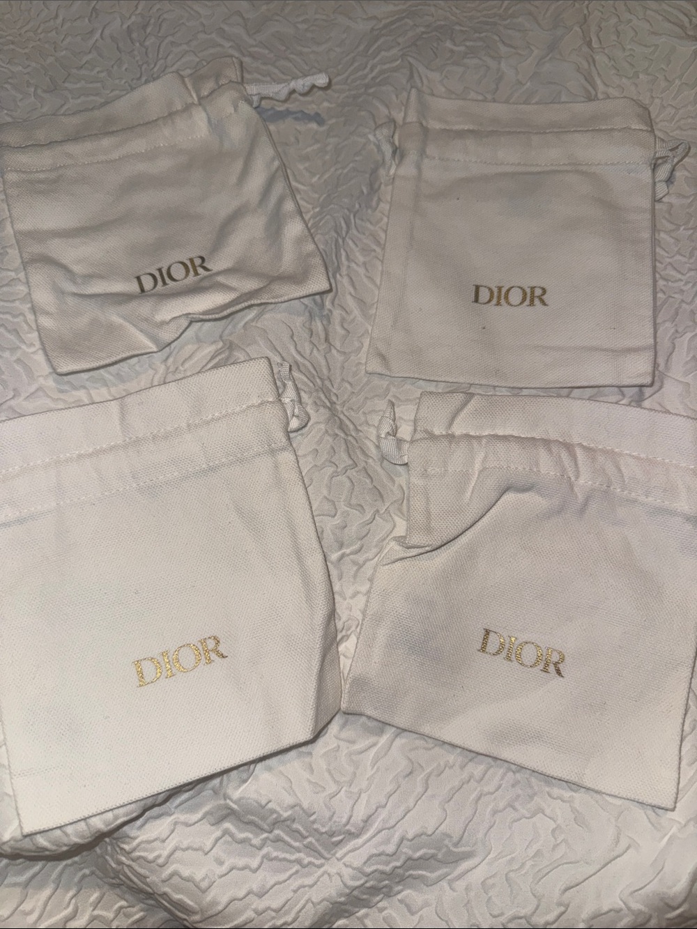 Dior White Drawstring Logo Pouches with Gold Print - Set of 4